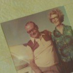 Grandparents beside car